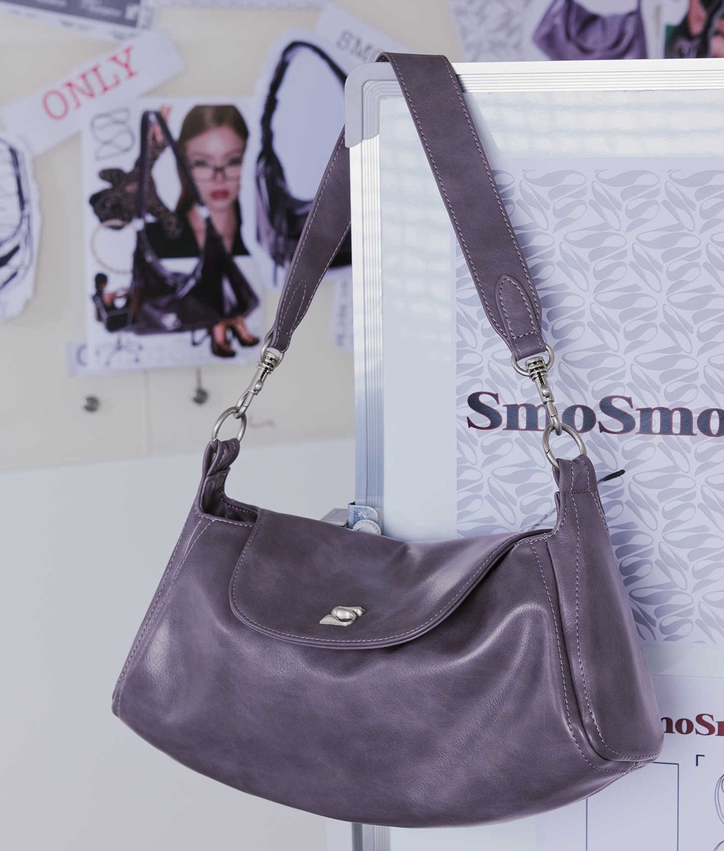 Black modern locomotive-style shoulder handbag