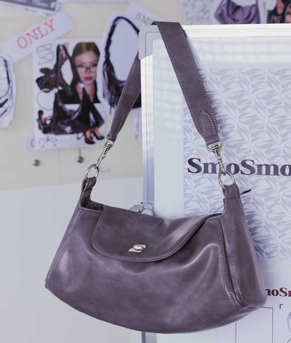 Black modern locomotive-style shoulder handbag