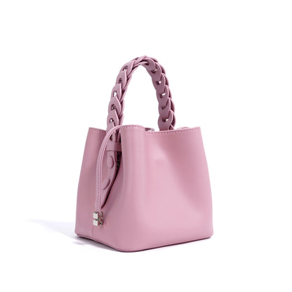 Front view of hand-woven mini crossbody bucket bag