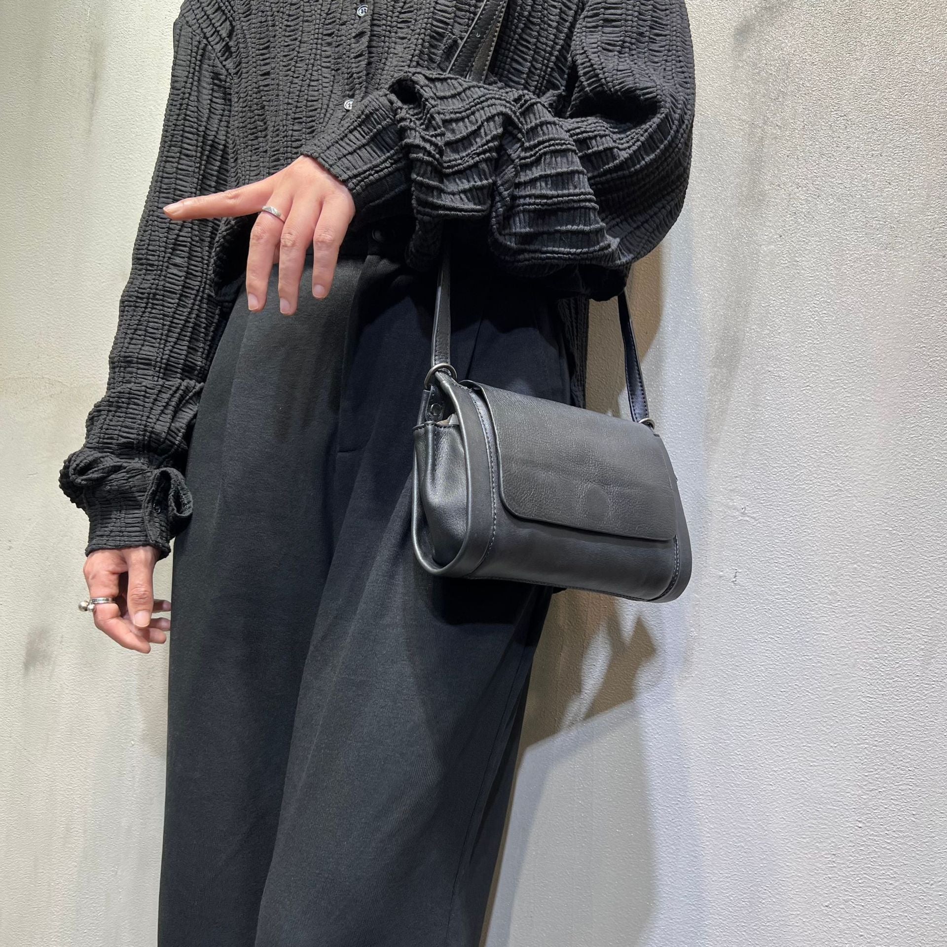 Structured horizontal square-shaped leather purse