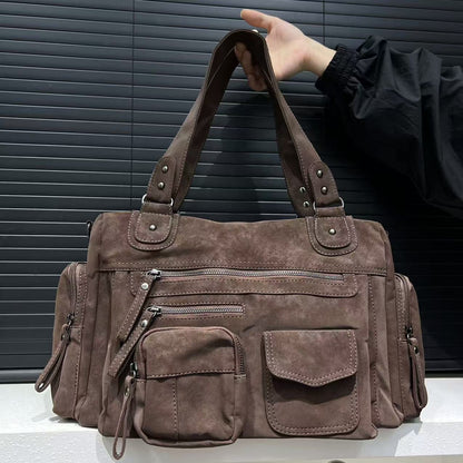 Inside view showing multiple compartments for phone, laptop, camera