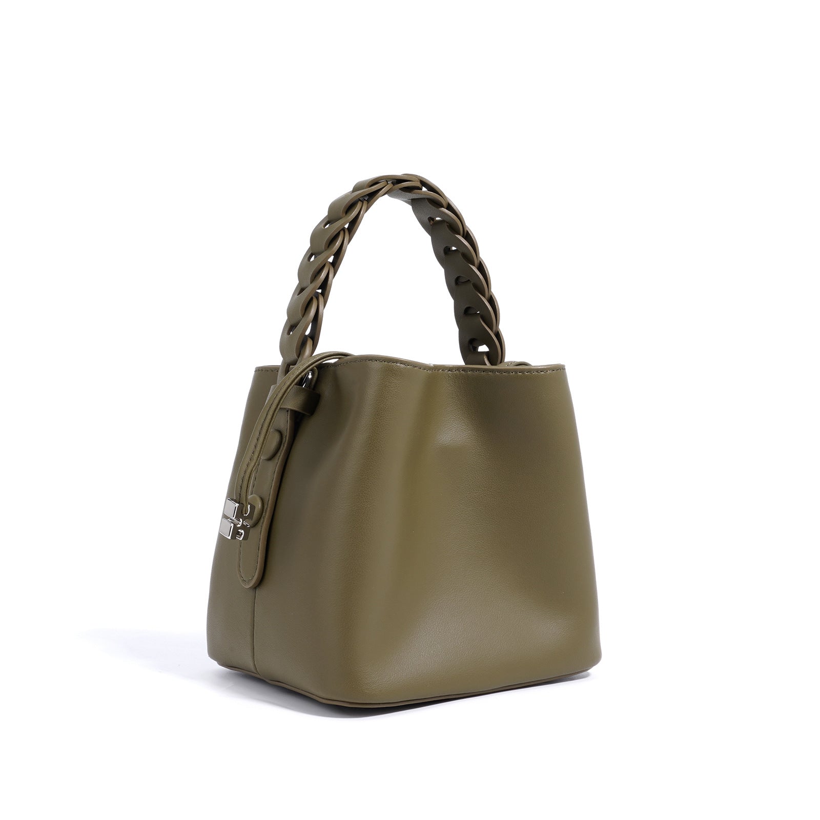 Mini cylindrical crossbody bag styled on neutral surface