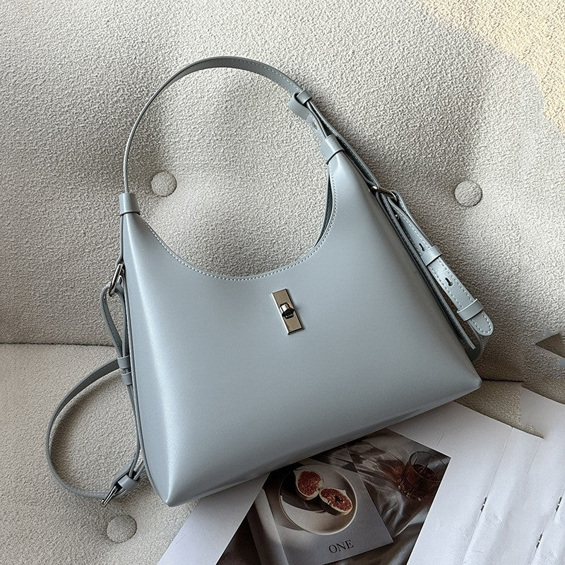 Interior view of leather bag showing zipper and phone pockets