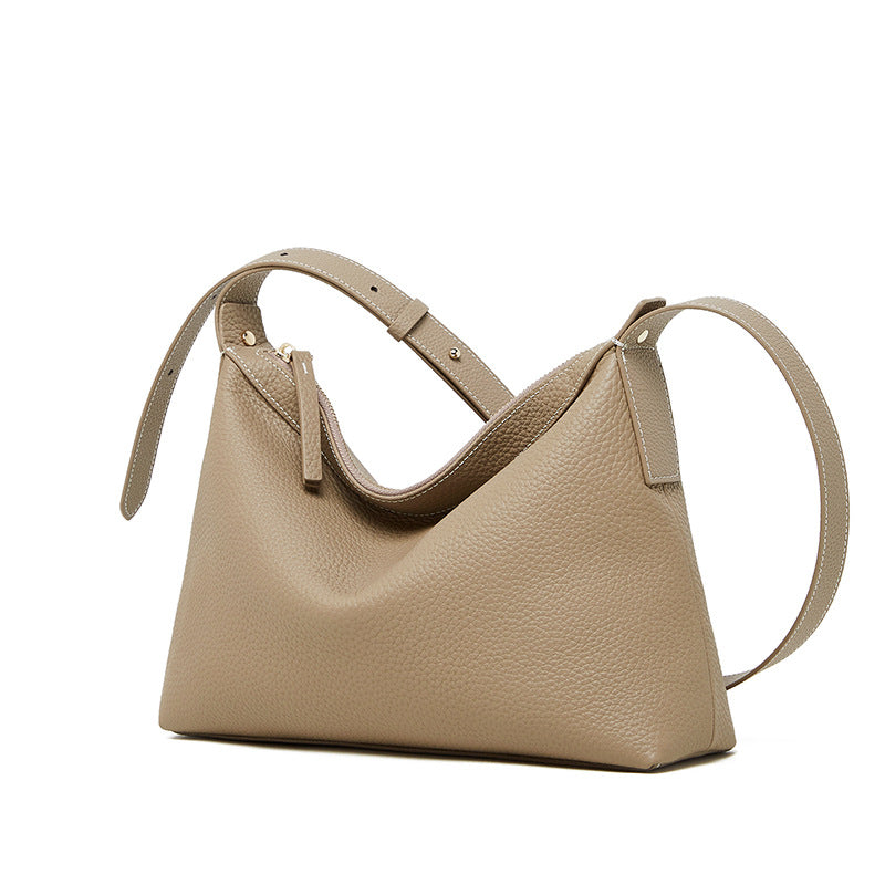 Side profile of uniquely shaped leather shoulder bag