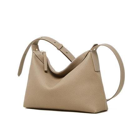 Side profile of uniquely shaped leather shoulder bag