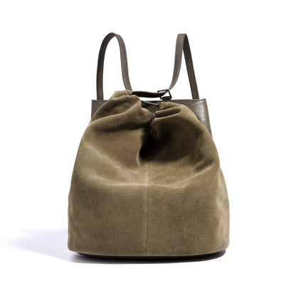 Side angle of niche-style suede-textured leather backpack