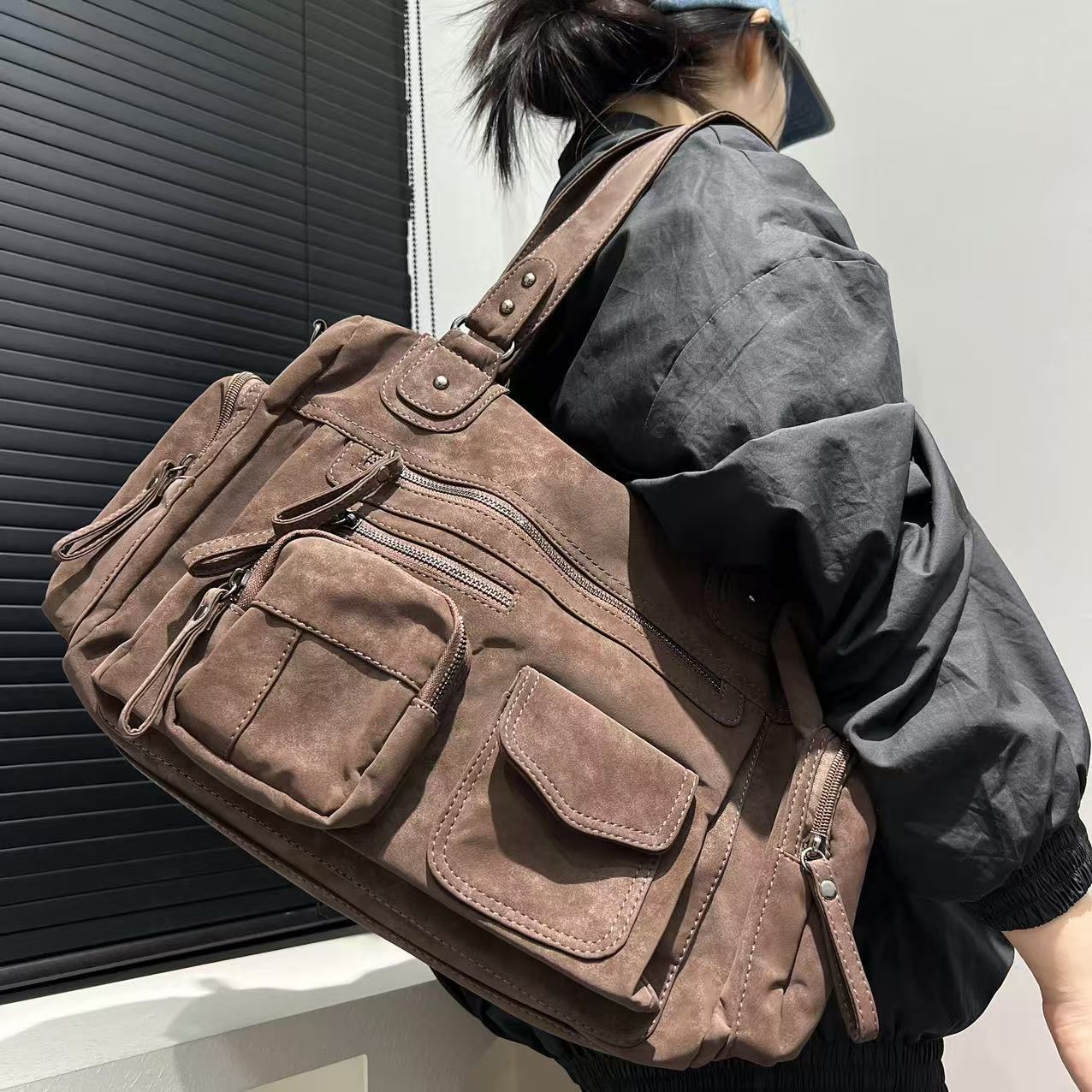 Side profile of brown suede PU tote bag