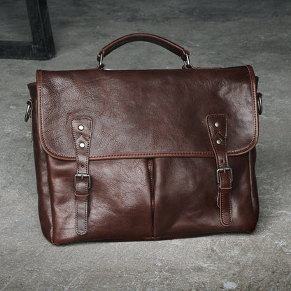 Open view showing inside compartments of leather bag