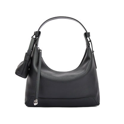 Woman carrying modern urban cowhide leather purse