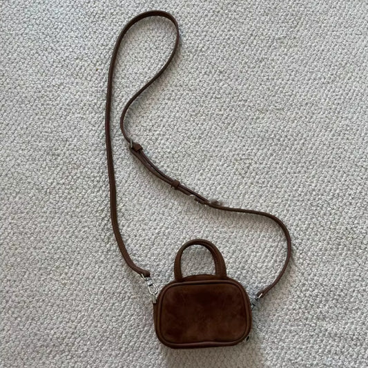 Dark brown cowhide mini bowling crossbody bag