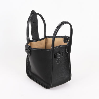 Size comparison of small and large cowhide dumpling tote bags