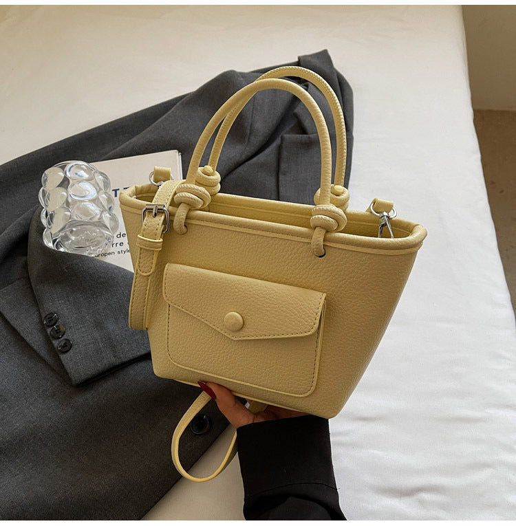 Korean minimalist style crossbody PU leather bag in lifestyle setting