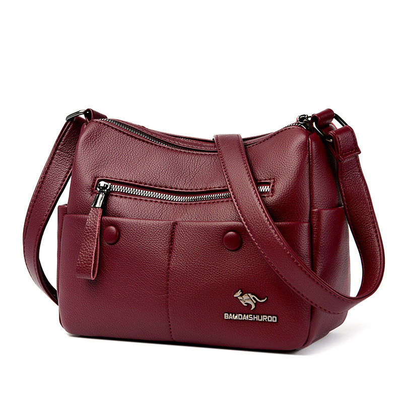 Woman holding soft PU leather shoulder bag for casual daily use