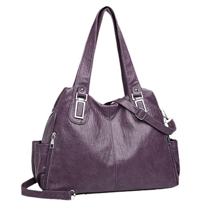 Woman wearing large PU leather European-style shoulder tote bag