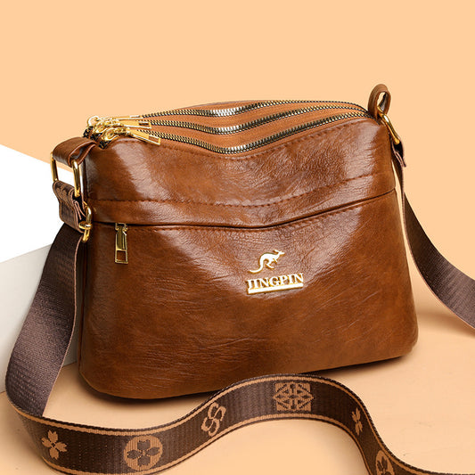 Front view of large capacity PU leather multi-compartment crossbody bag