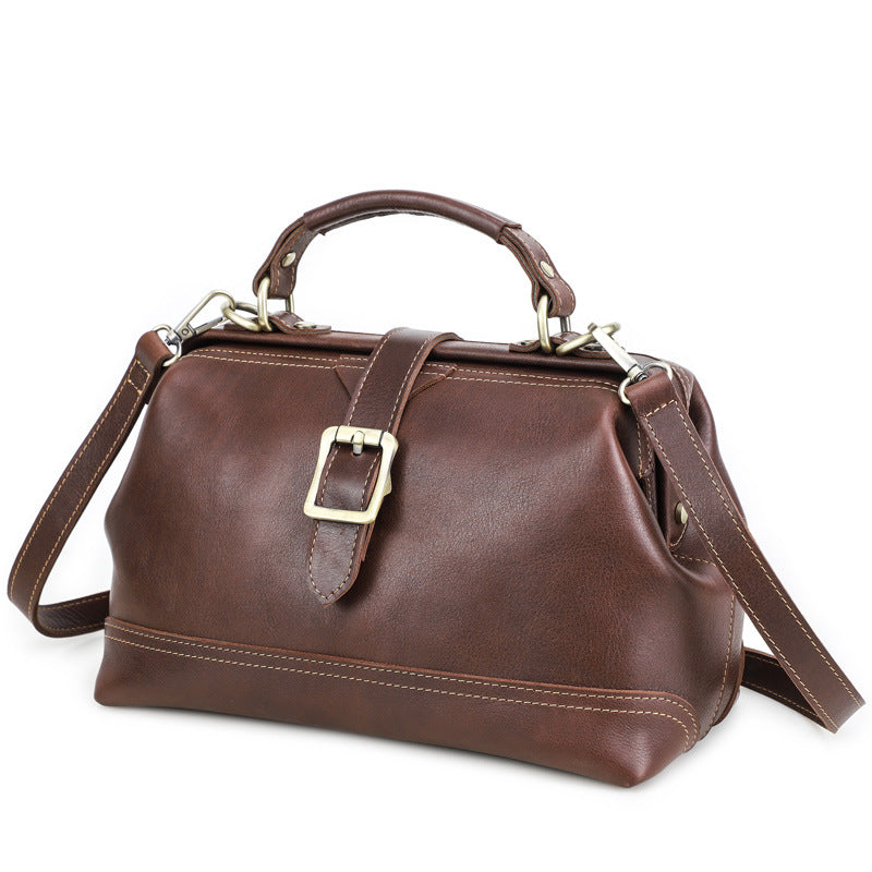 Back view of reddish brown leather women’s shoulder bag