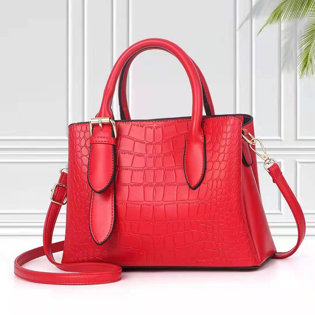 Woman carrying red PU leather crossbody commuter tote