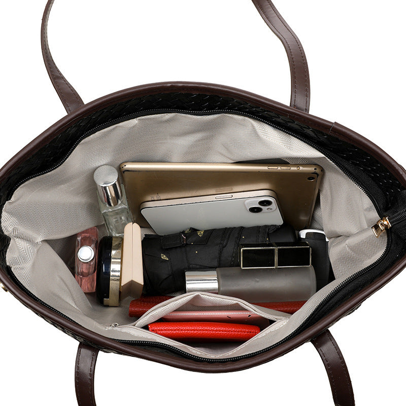 Close-up of PU leather texture and zipper on commuter handbag