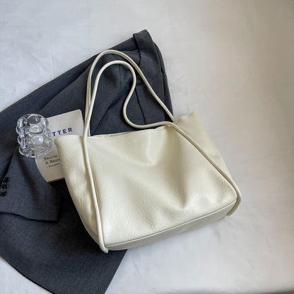 Interior zipper pocket of soft PU leather travel tote bag