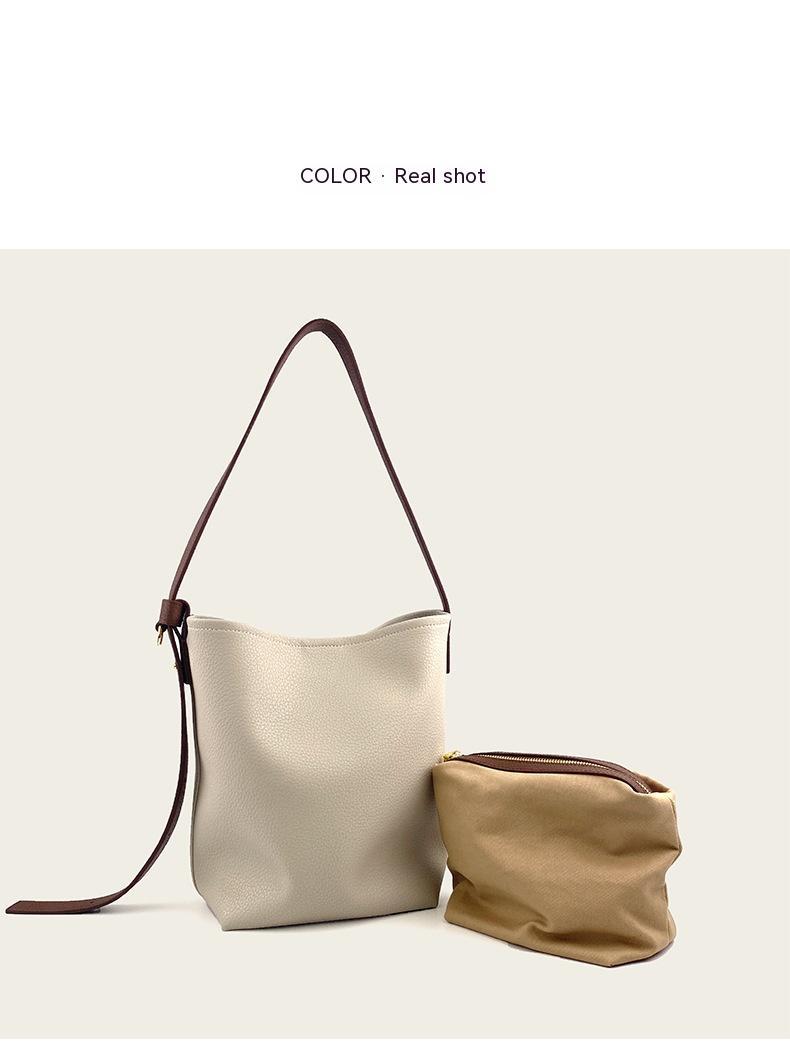 Interior view of multi-compartment cowhide crossbody bucket purse