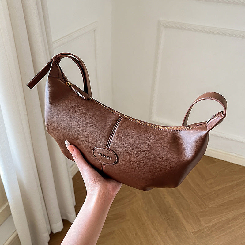 Top view showing zipper and single shoulder strap