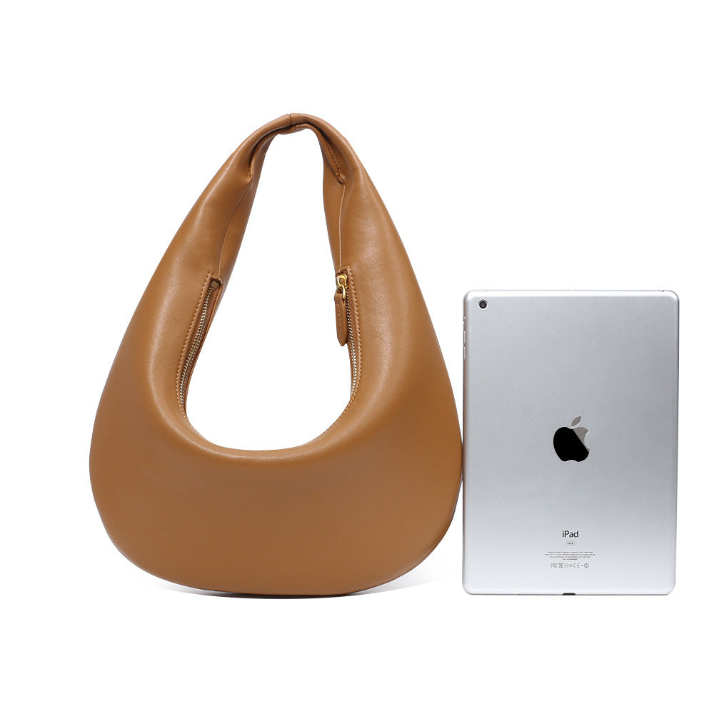 Top view of soft leather shoulder bag in retro minimalist style