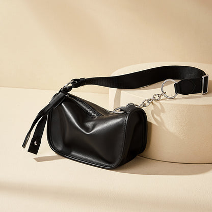 Black underarm crossbody styled with casual street outfit
