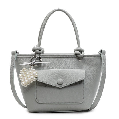 Gray handbag with a pearl charm
