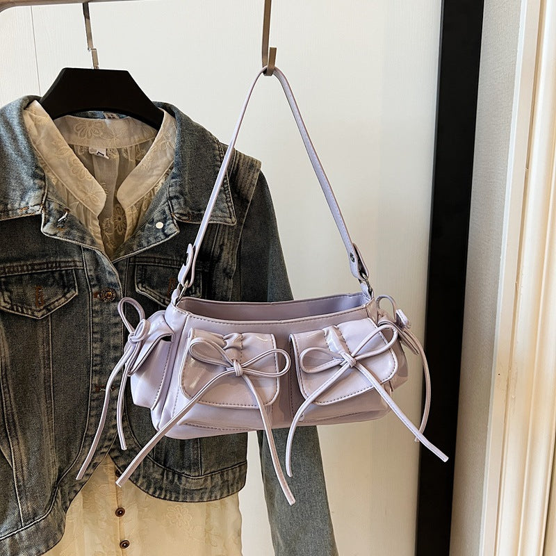 Open view of pleated handbag showing multiple pockets