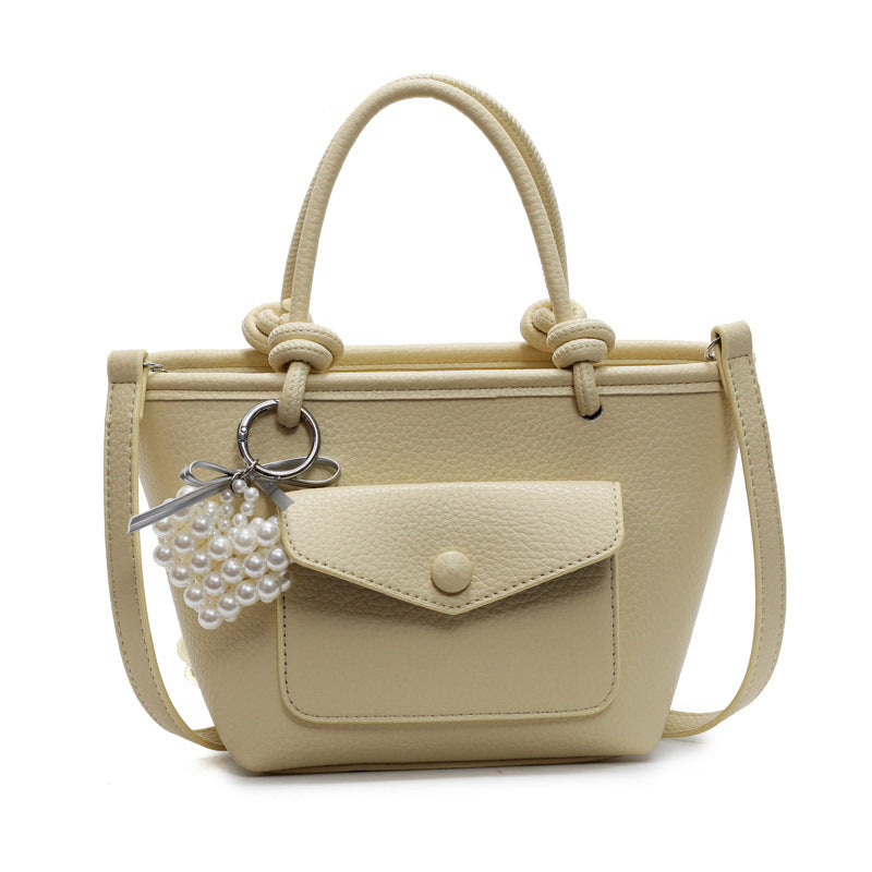 Flat lay of trendy Korean PU leather shoulder crossbody bag on white background