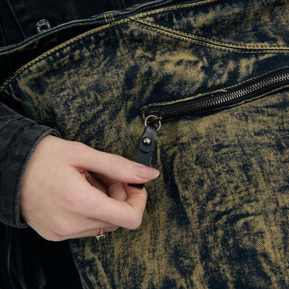 Close-up of washed black tassel details
