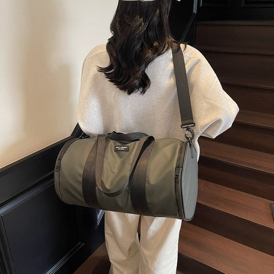 Black waterproof unisex Oxford sports handbag shown from front