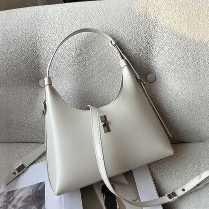 White handbag on a textured surface