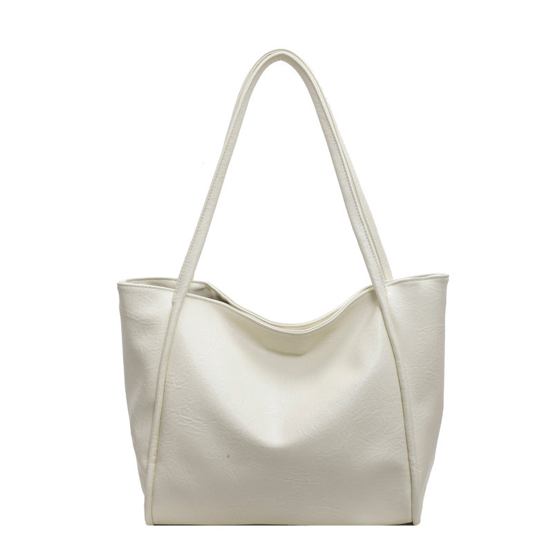 Side view of soft PU leather shoulder tote for casual urban use