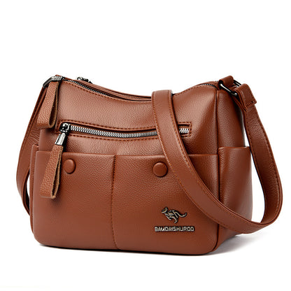 Close-up of stitching and zipper pocket on PU leather tote bag